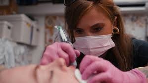 High quality tattoo machine with metal finish on dark surface